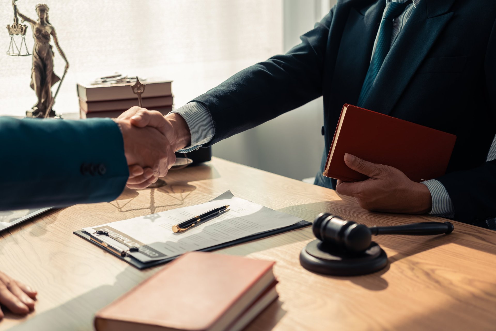 Lawyer and client handshake