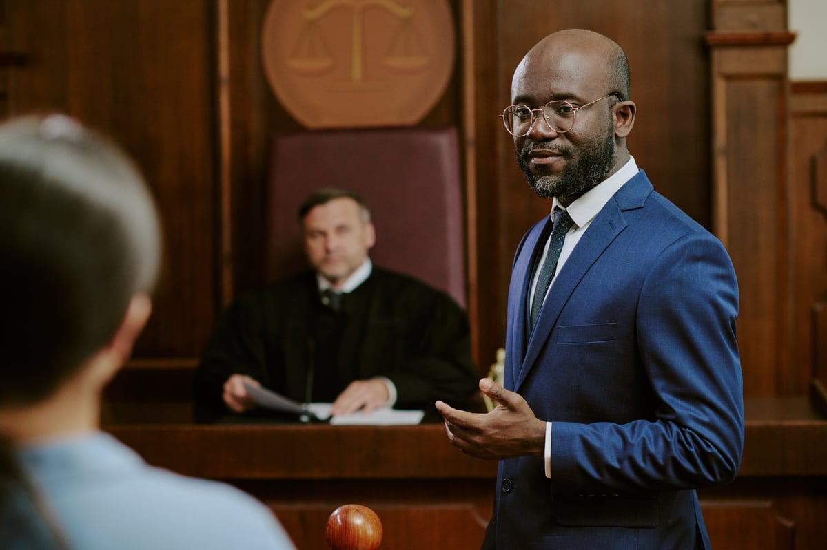 Criminal defense attorney addressing courtroom